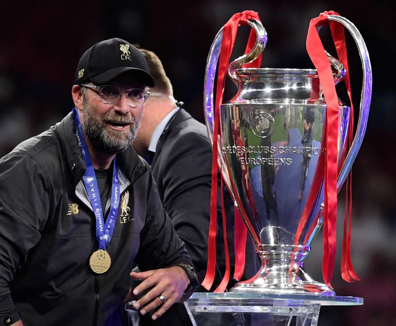 A delighted Klopp looks at the European Cup moments before he and his players received it. AFP