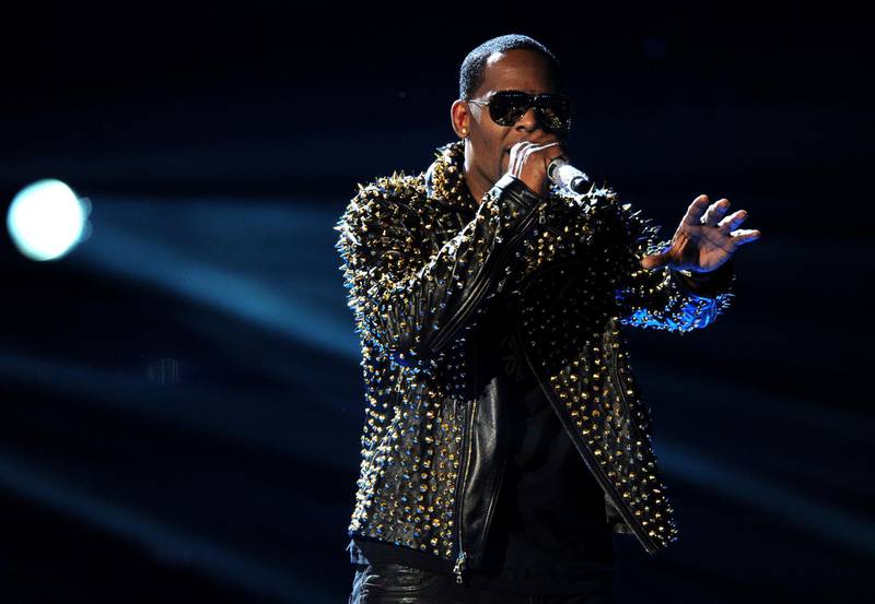 FILE - In this June 30, 2013, file photo, R. Kelly performs onstage at the BET Awards at the Nokia Theatre in Los Angeles. Spotify has removed R. Kellyâ€™s music from its playlists, citing its new policy on hate content and hateful conduct. (Photo by Frank Micelotta/Invision/AP, File)