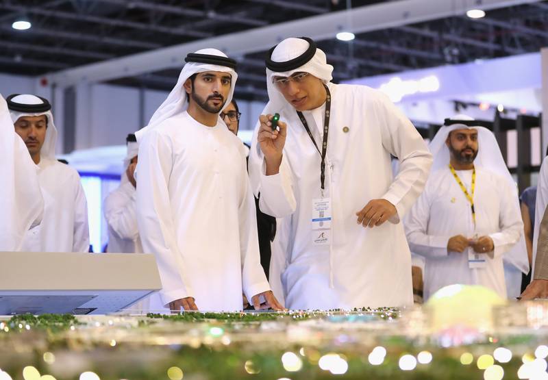 Sheikh Hamdan bin Mohammed, Crown Prince of Dubai, speaks to Ahmed Al Khatib during Cityscape Global. Francois Nel / Getty Images
