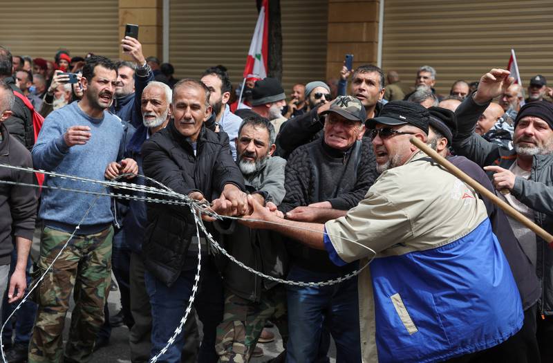 Retired Lebanese soldiers vent their anger during the protest. Reuters