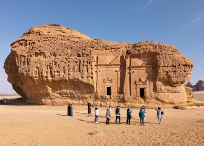 2. Saudi Arabia: Tourists visit the ancient archaeological site of Hegra in AlUla. Bloomberg