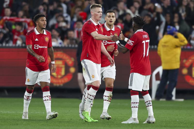 Manchester United's Scott McTominay, centre, is congratulated by teammates after scoring his team's first goal. AP