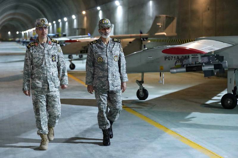 Commander-in-Chief of the Iranian Army Maj Gen Abdolrahim Mousavi, right, and Armed Forces Chief of Staff Maj Gen Mohammad Bagheri visit an underground drone base in Iran. AFP