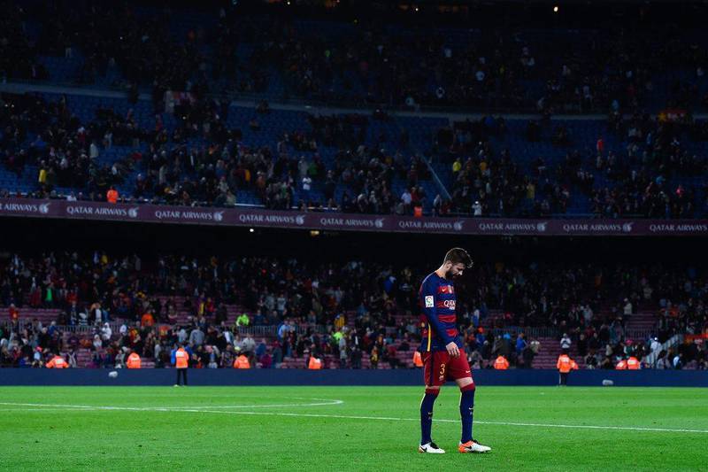 Gerard Pique of FC Barcelona leaves the pitch dejected at the end of the La Liga match between FC Barcelona and Valencia CF at Camp Nou on April 17, 2016 in Barcelona, Spain. (Photo by David Ramos/Getty Images)