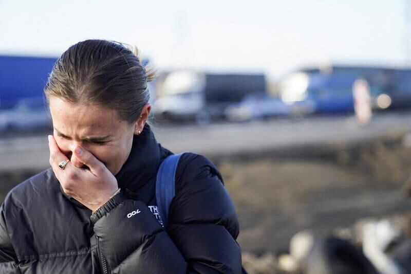 An American woman in distress after crossing the border to flee the violence in Ukraine, in Medyka, Poland. Reuters