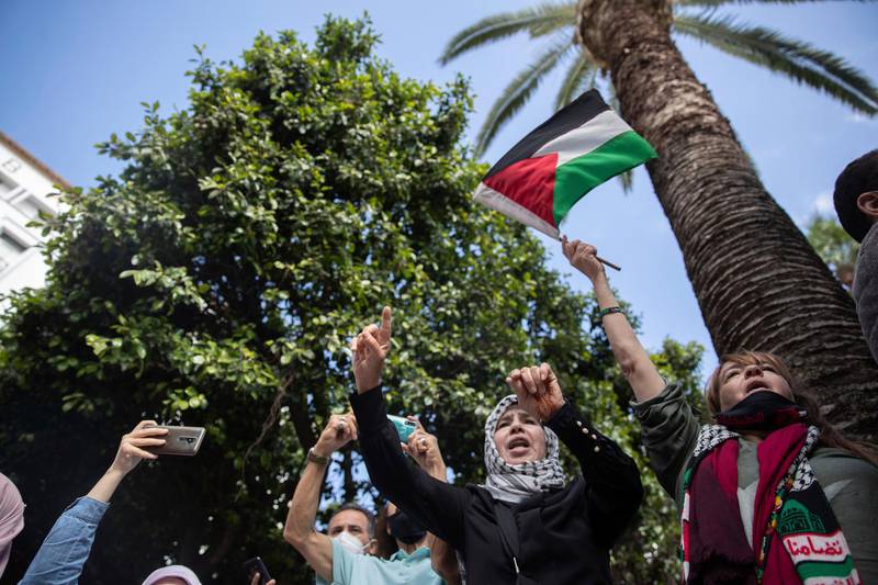 Protesters shout slogans and wave a flag during a protest in solidarity with Palestinians, in Rabat, Morocco. AP