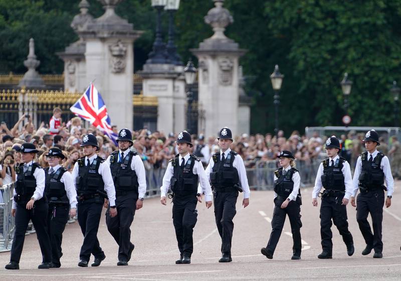 Police officers are seen outside of Buckingham Palace. PA
