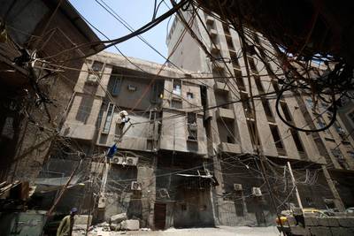A web of electrical wires between buildings in Baghdad. Iraq has long suffered from energy supply problems. AFP