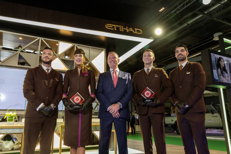 Tony Douglas and Etihad Airways Cabin Crew. Etihad was recognised as the airline with the "Best Cabin Crew" as well as being awarded the "Best First Class" at the Business Traveller Middle East Awards. Photo: Etihad