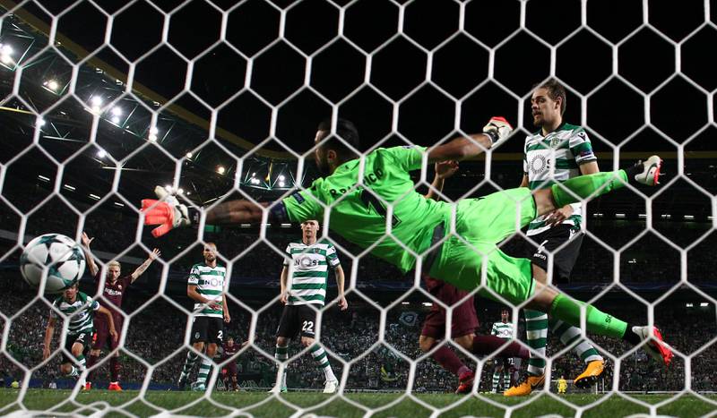 Sporting’s Sebastian Coates scores Barcelona's first with an own goal. Pedro Nunes / Reuters