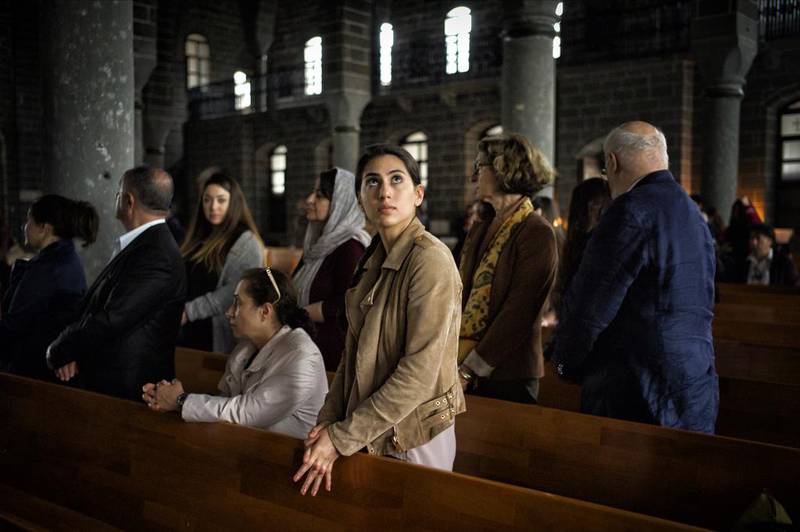 A young French-Armenian woman prays during Easter Sunday mass at Surp Giragos Ermeni Churche in Diyarbakır, Turkey. The church, which had fallen into ruin after the 1915 Armenian Genocide, was recently renovated and Armenians, many of them children and grandchildren of those who had been forced to flee, came from all around the world to celebrate Easter at their ancestors’ church. Scout Tufankjian