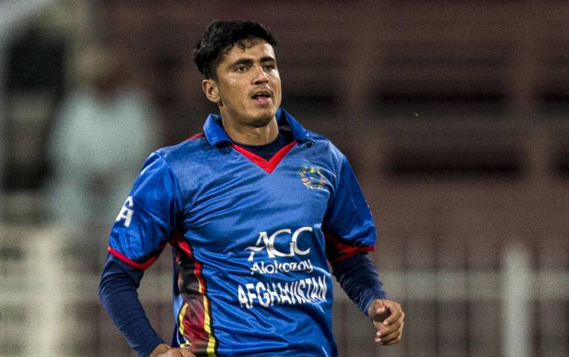 Afghanistan's Mujeeb Zadran celebrates the wicket of Ireland's William Porterfield during the third one day international (ODI) cricket match between Afghanistan and Ireland at Sharjah Cricket Association Stadium in Sharjah on December 10, 2017. / AFP PHOTO / NEZAR BALOUT