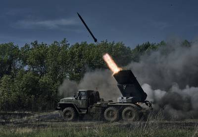 A Ukrainian army multiple rocket launcher fires at Russian positions on the front line near Bakhmut. AP