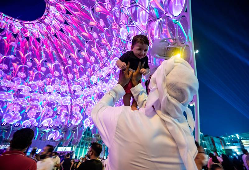 A young visitor enjoys the spectacular light show at Al Wasl Plaza. Victor Besa / The National