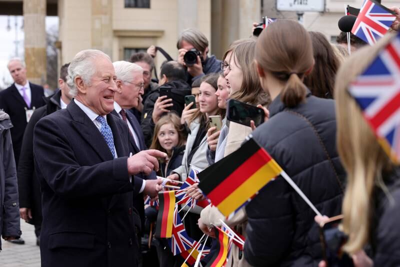King Charles greets the crowd during a ceremonial welcome at Brandenburg Gate in Berlin, Germany. Getty Images