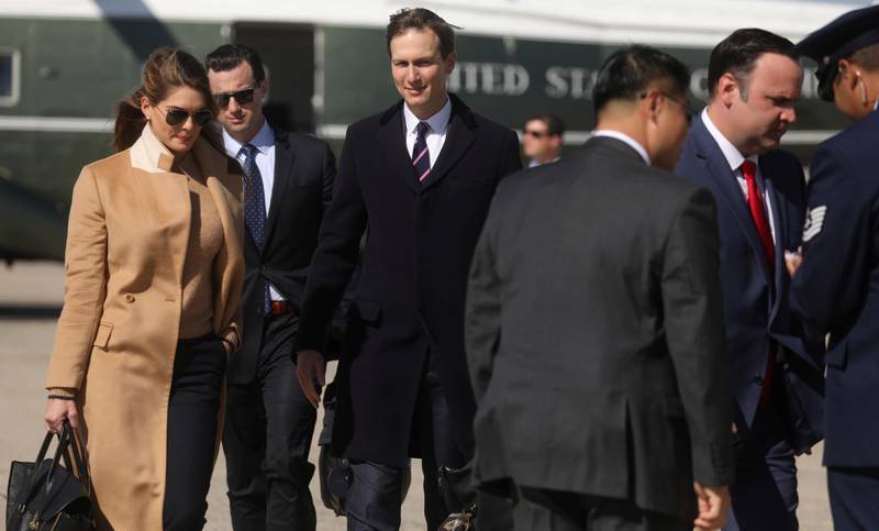 Hope Hicks, left, an adviser to US President Donald Trump; White House adviser Jared Kushner; and White House Social Media Director Dan Scavino walk to Air Force One to accompany the president on a campaign trip to Minnesota from Joint Base Andrews, Maryland. Reuters