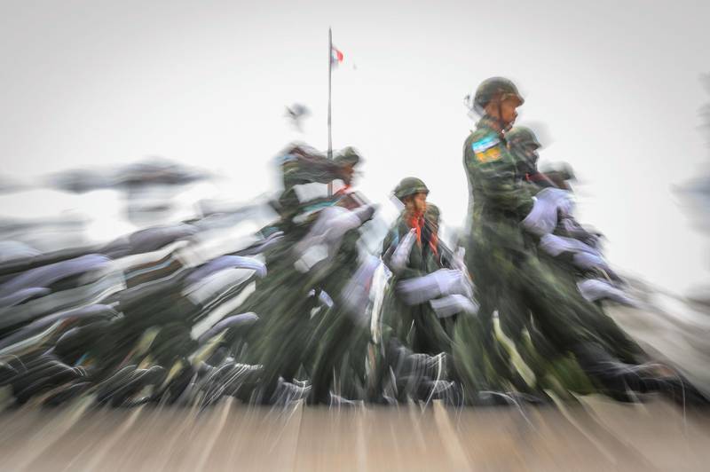 Military personnel march during the official handover ceremony for the Royal Thai Army Commander-in-Chief in Bangkok. AFP