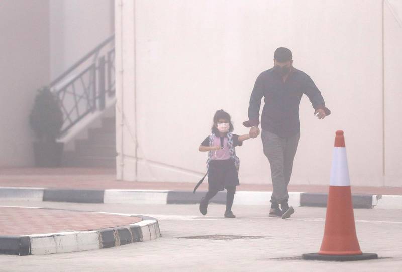 Abu Dhabi, United Arab Emirates, February 14, 2021. Pupils return to Abu Dhabi's private schools. GEMS United Indian School – Abu Dhabi.  A few students arrive in spite of the foggy conditions.Victor Besa/The NationalSection: NAReporter:  Anam Rizvi