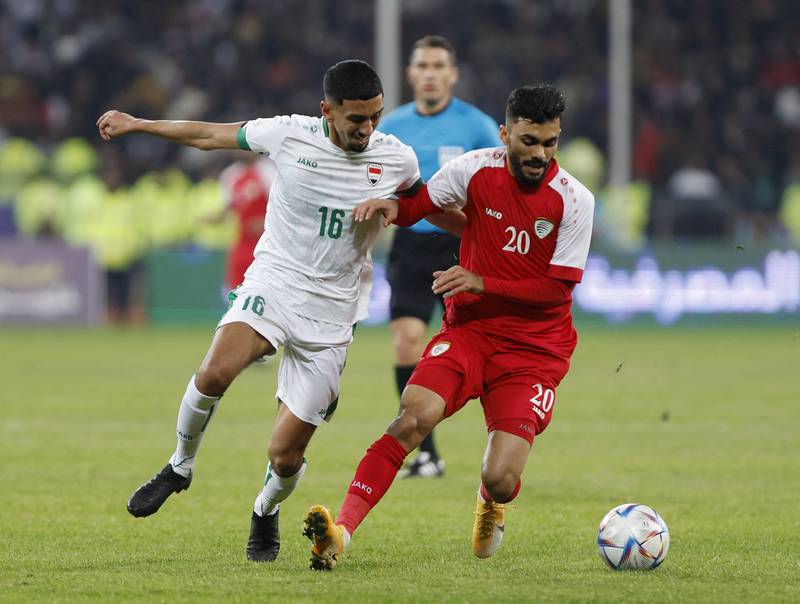 Iraq's Amir Al Ammari in action with Oman's Salaah Al Yahyaei. Reuters