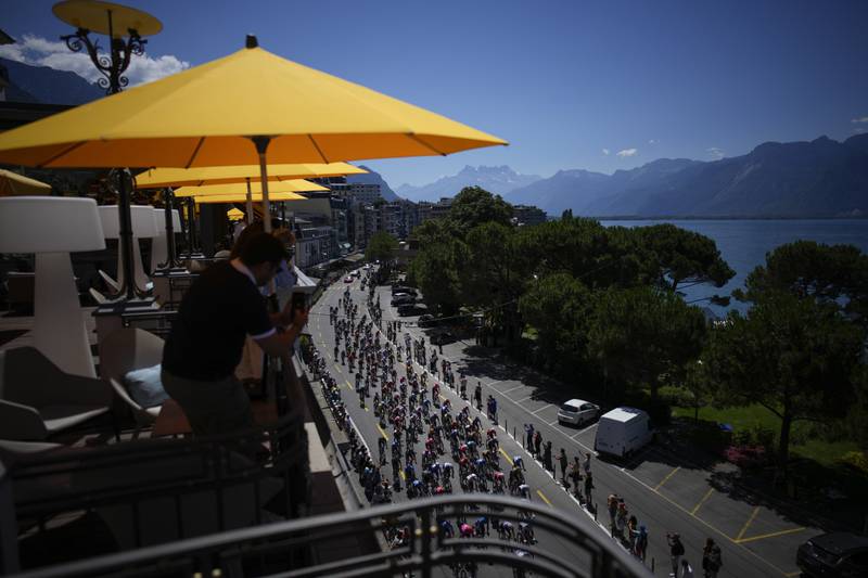 Spectators watch the riders pass in Montreux, Switzerland, during  Stage 9. AP