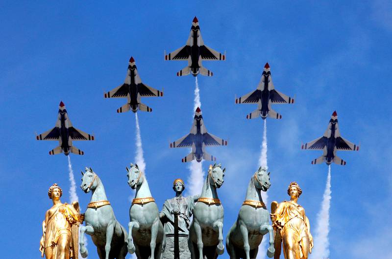 The US Air Force Thunderbirds fly over the Arc de Triomphe during the Bastille Day military parade in Paris. Philippe Wojazer / Reuters