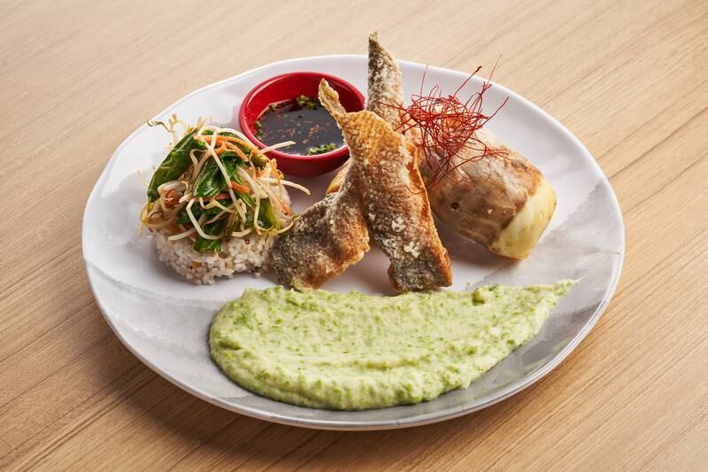 Crispy sea bass with wasabi-potato puree, steamed rice and stir-fried vegetables.