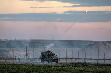 Israeli jeep fires tear-gas during clashes after Friday protests near the border between Israel and Gaza Strip. EPA