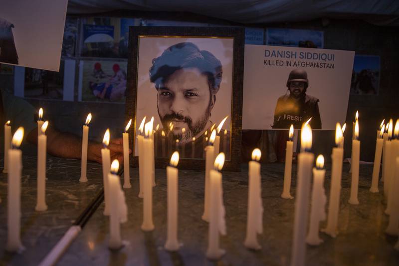 Journalists in New Delhi, India, light candles and pay tribute to Reuters photographer Danish Siddiqui, who was killed in Afghanistan covering clashes between the Taliban and Afghan security forces. AP