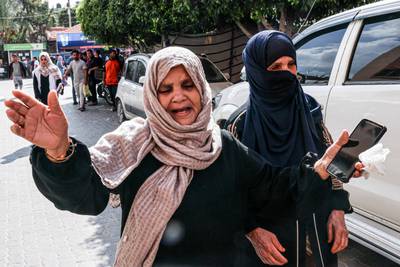 Mourners react during Thursday's funeral of the Abu Al Rish family, killed during an Israeli air strike in Khan Yunis, on the southern Gaza Strip.  AFP