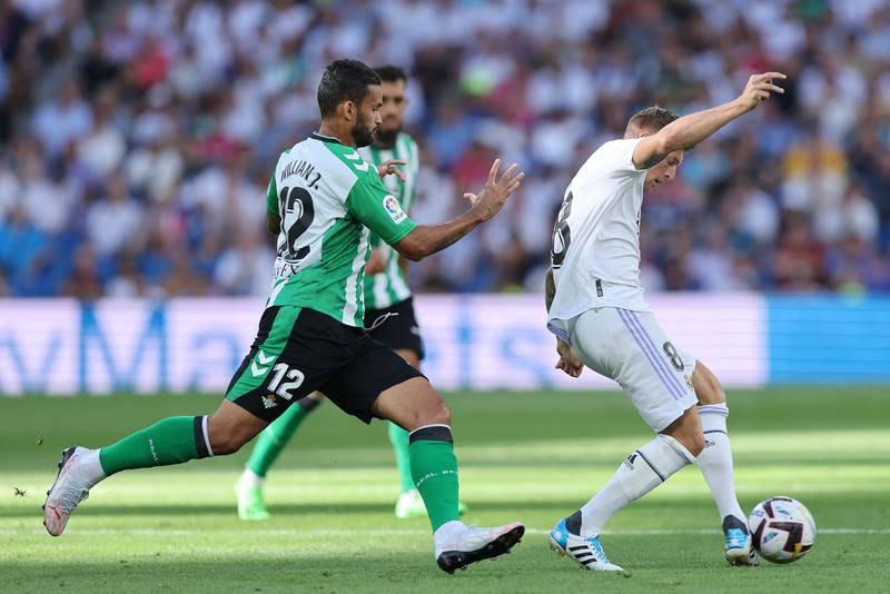 Real Betis midfielder Willian Jose fights for the ball with Real Madrid midfielder Toni Kroos. AFP