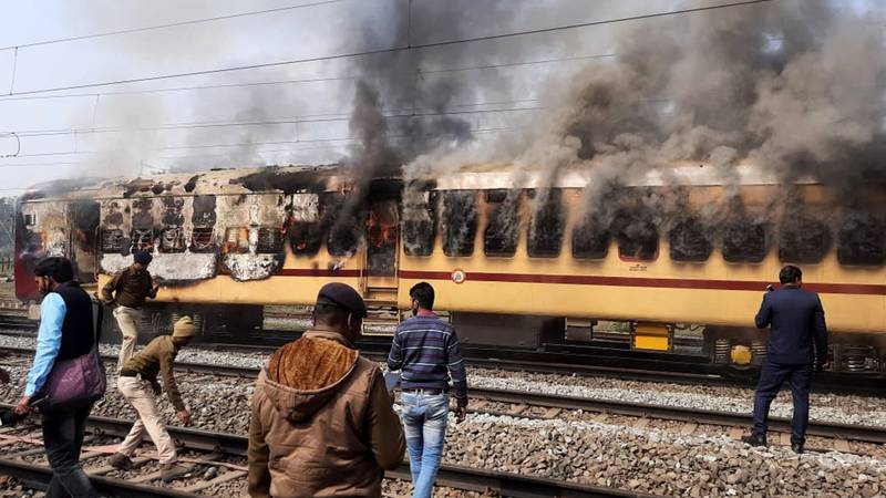 An image that illustrates this article Indian jobseekers set trains on fire in protest against railway hiring  
