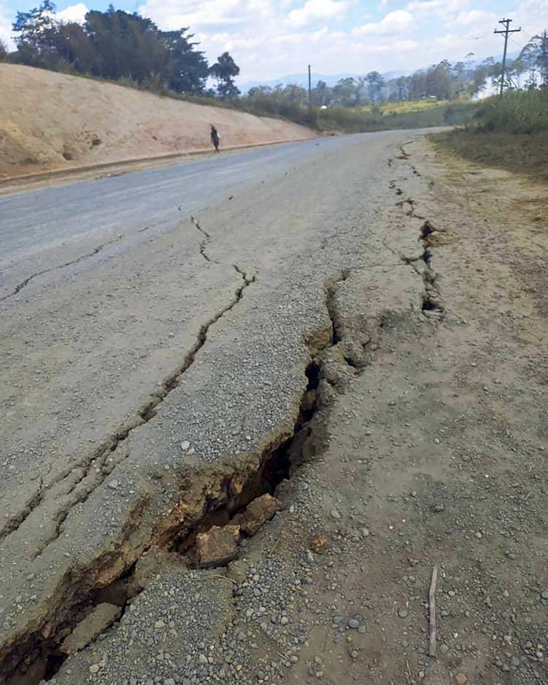 Debris lies strewn across a highway following a landslide near the town of Kainantu, following a 7.6-magnitude earthquake in north-eastern Papua New Guinea. All photos by AP