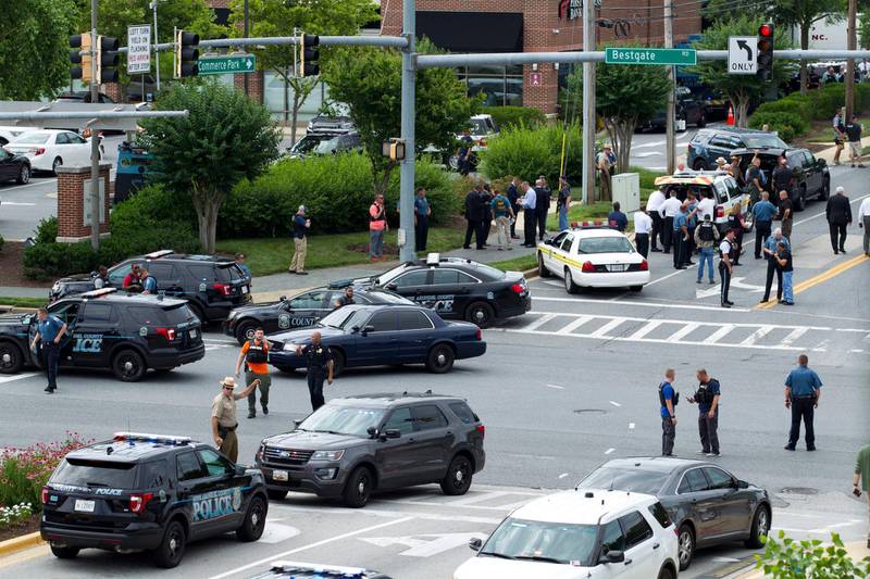 Police officers in the Maryland capital city of Annapolis responded within minutes to a 911 call about a shooting in progress at the offices of the Capital Gazette newspaper group and apprehended the suspect hiding under a desk, authorities said. Jose Luis Magana / AP Photo