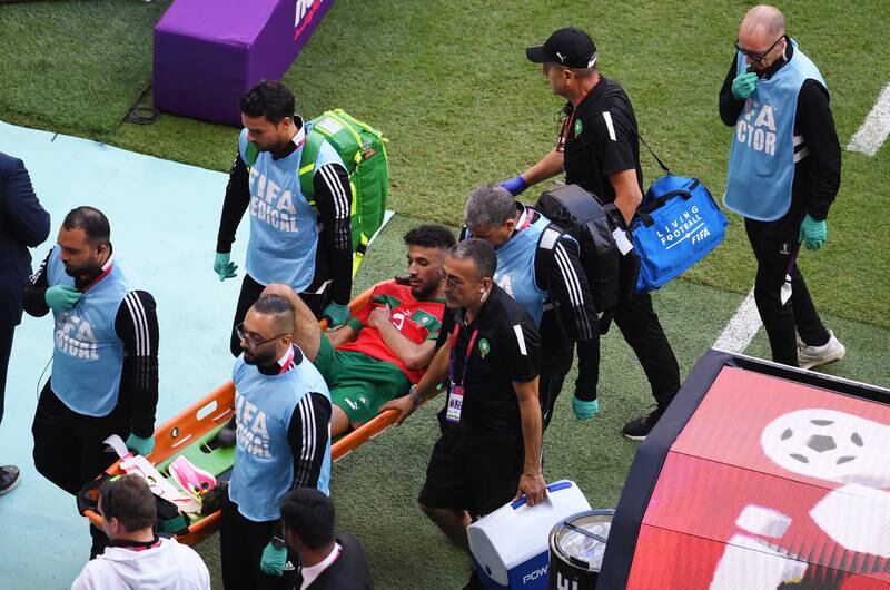 Noussair Mazraoui of Morocco is stretchered off the pitch. Getty