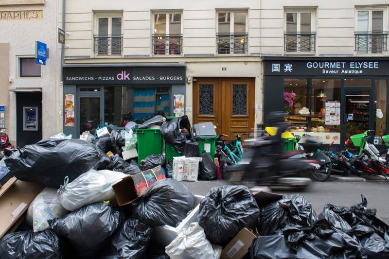 Rubbish piled up on the streets of Paris as waste collectors walked out. Bloomberg 