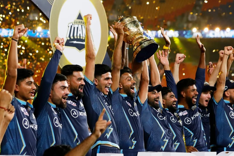 Gujarat Titans celebrate with the trophy after winning the 2022 Indian Premier League. Photo: IPL