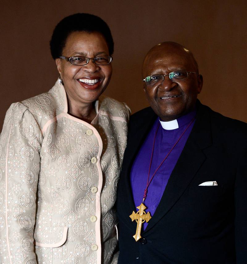 Archbishop Desmond Tutu with Graca Machel, the wife of former South African president Nelson Mandela. AFP