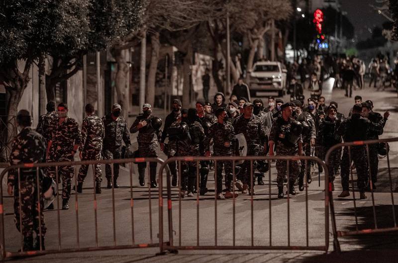 Lebanese riot control police watch as annti-government protesters gather during a demonstration against the collapsing Lebanese currency and the price hikes of goods, in Beirut, Lebanon.  EPA