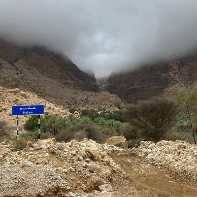 Low cloud hangs over a wadi. Officials said more rain is expected in some areas