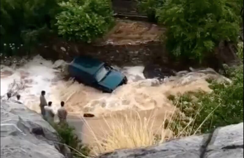 The rains caused wadis to flood. Police detained one motorist who it said drove through a wadi endangering his life. Photo: Royal Oman Police