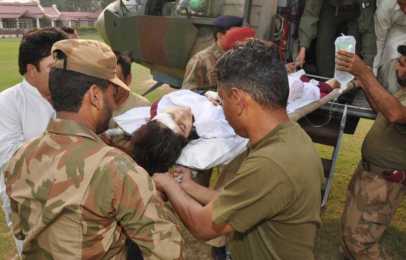 Pakistani soldiers carry Malala from a helicopter to a military hospital in Peshawar, Pakistan. She whould be later transferred from Pakistan to the UK via Abu Dhabi for life-saving treatment. Inter Services Public Relations Department / AP Photo