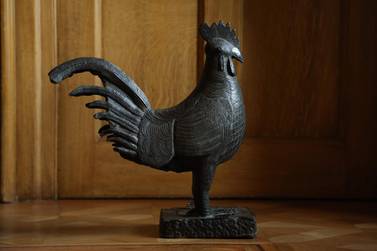 A Cambridge University college has said it will return a bronze cockerel statue looted from Nigeria, which formed the focus of protests over symbols of Britain's colonial past. AFP