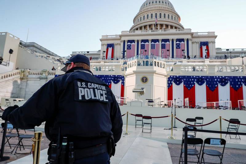 A U.S. Capitol police officer stands on the West Front of the Capitol before Joe Biden's presidential inauguration in Washington, U.S., January 20, 2021. REUTERS/Jim Bourg