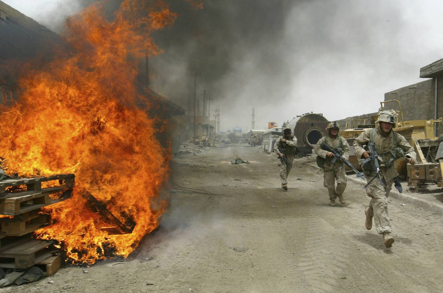 US Marines burn their fortifications on frontline positions in Fallujah, Iraq, before pulling out of the city, in 2004. AP Photo