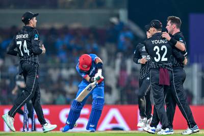 New Zealand's Matt Henry (R) celebrates with teammates after taking the wicket of Afghanistan's Rahmanullah Gurbaz (2L) during the 2023 ICC Men's Cricket World Cup one-day international (ODI) match between New Zealand and Afghanistan at the MA Chidambaram Stadium in Chennai on October 18, 2023.  (Photo by R. Satish BABU  /  AFP)  /  -- IMAGE RESTRICTED TO EDITORIAL USE - STRICTLY NO COMMERCIAL USE --