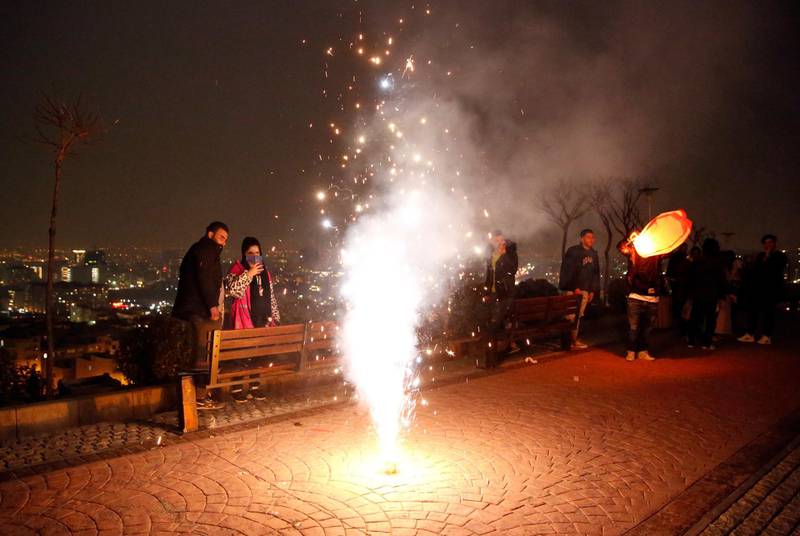 People gather to mark the traditional Charshanbeh Suri fire festival, in Tehran. It is held on the eve of the last Wednesday before Nowruz, the Iranian New Year, which starts on March 21. EPA