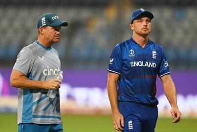 Matthew Mott, England coach, and captain Jos Buttler look stoney-faced after losing to South Africa at Wankhede Stadium. Getty