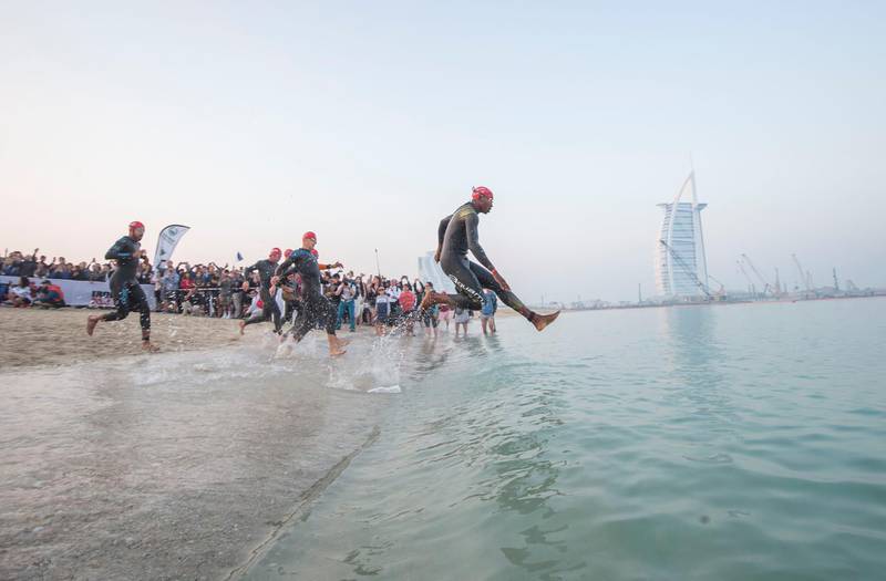 Dubai, United Arab Emirates - Ironman amateurs during  the race at the Ironman race at Jumeirah open beach, Dubai. Leslie Pableo for The National