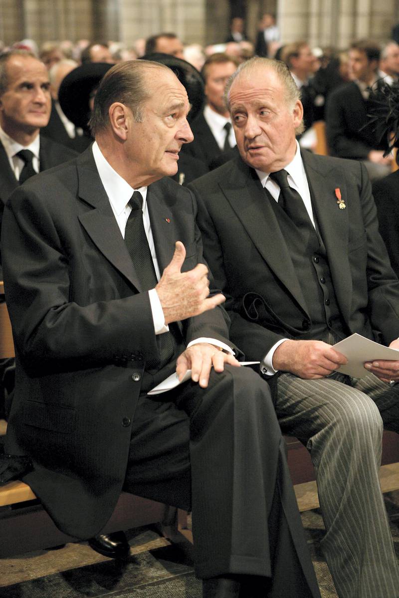 MONACO - APRIL 15: Jacques Chirac talks with Spanish King Juan Carlos inside the Cathedral at the funeral service of Monaco's Prince Rainier III at Monaco Cathedral on April 15, 2005 in Monte Carlo, Monaco. Prince Rainier III ruled the tiny Mediterranean principality for more than 55 years, becoming Europe's longest serving monarch. He died aged 81 on April 6 after battling heart, lung and kidney problems. (Photo by Pool/Getty Images)