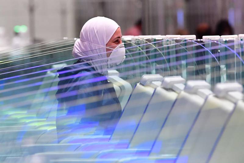 A tourist waits to have her papers checked on arrival at Terminal 3 at Dubai airport.  AFP